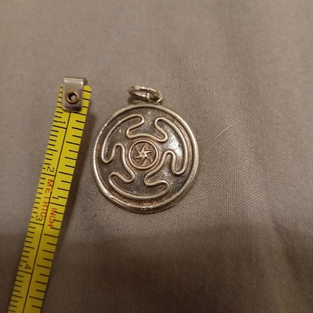 Silver Circular Pendant with Star Design